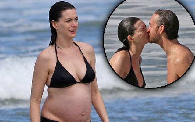 Bikini Clad Anne Hathaway Reveals Growing Baby Bump On Romantic