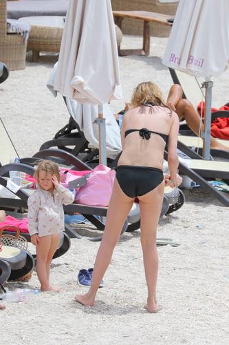 Sexier Than Ever At Uma Thurman Prances In Black Bikini In St