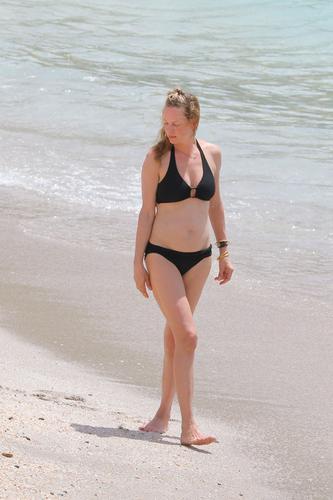 Sexier Than Ever At Uma Thurman Prances In Black Bikini In St