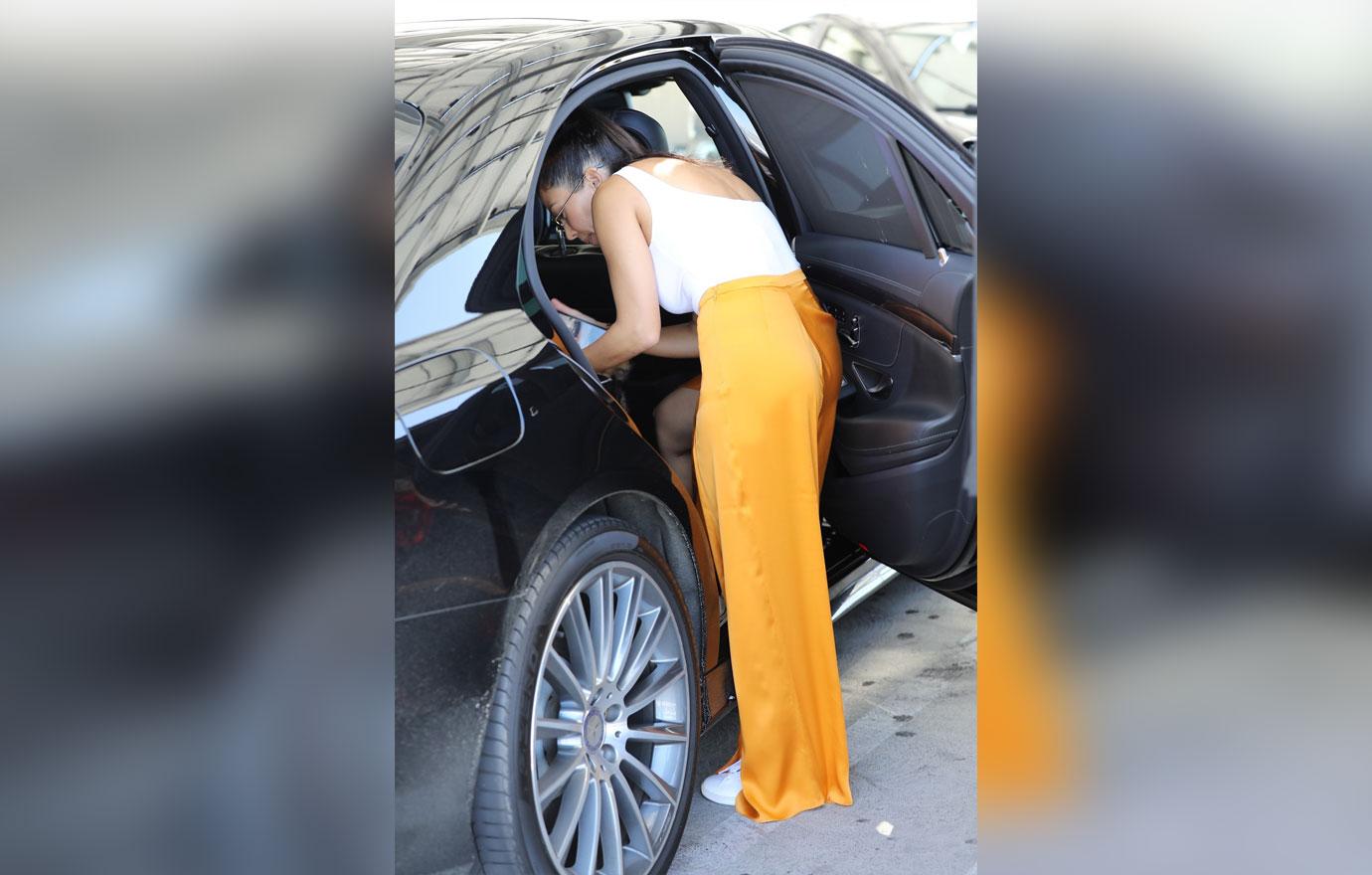 Kourtney Kardashian Goes Braless Yellow Pants