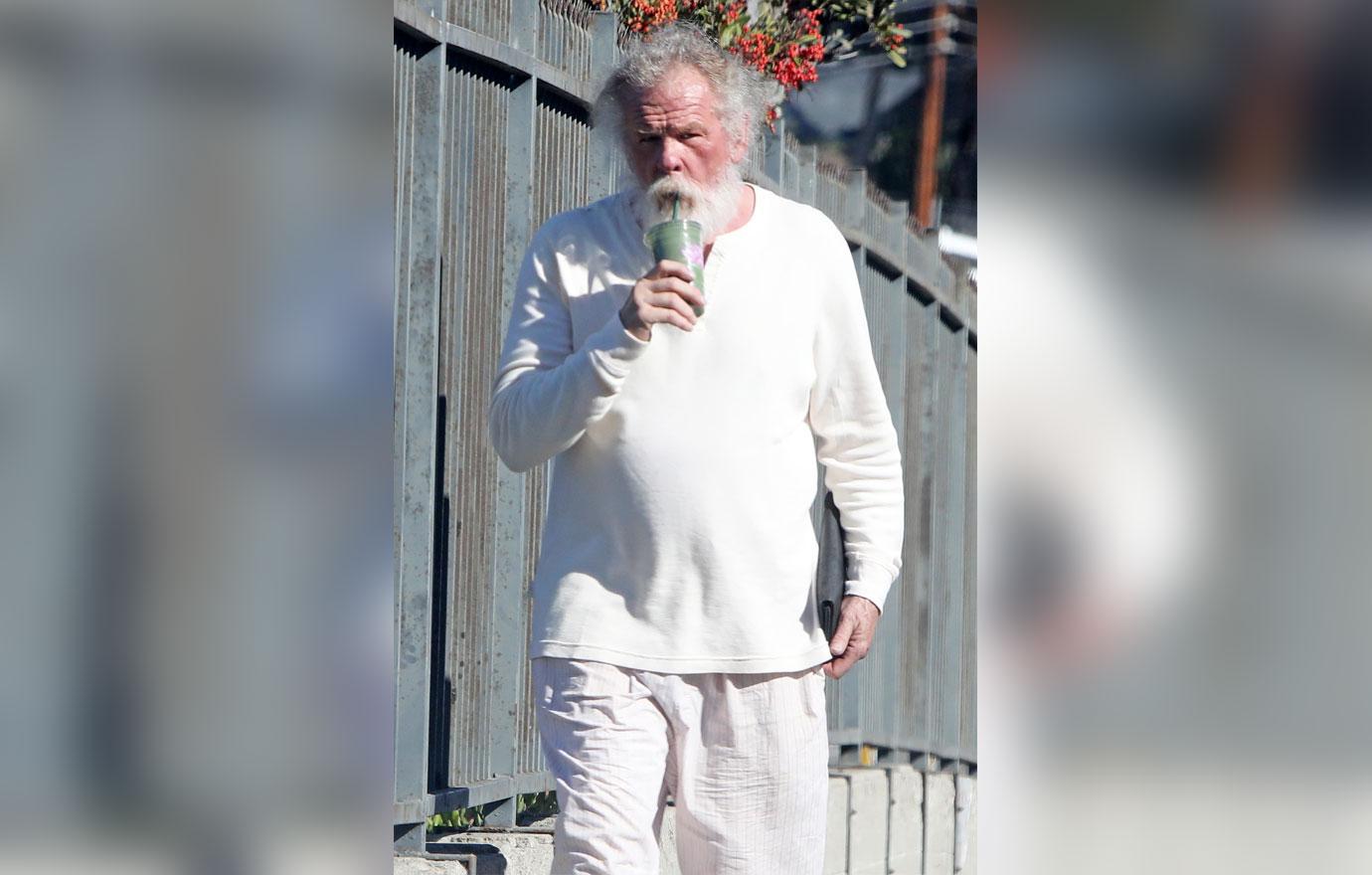 //Nick Nolte Climbs Fence Photos