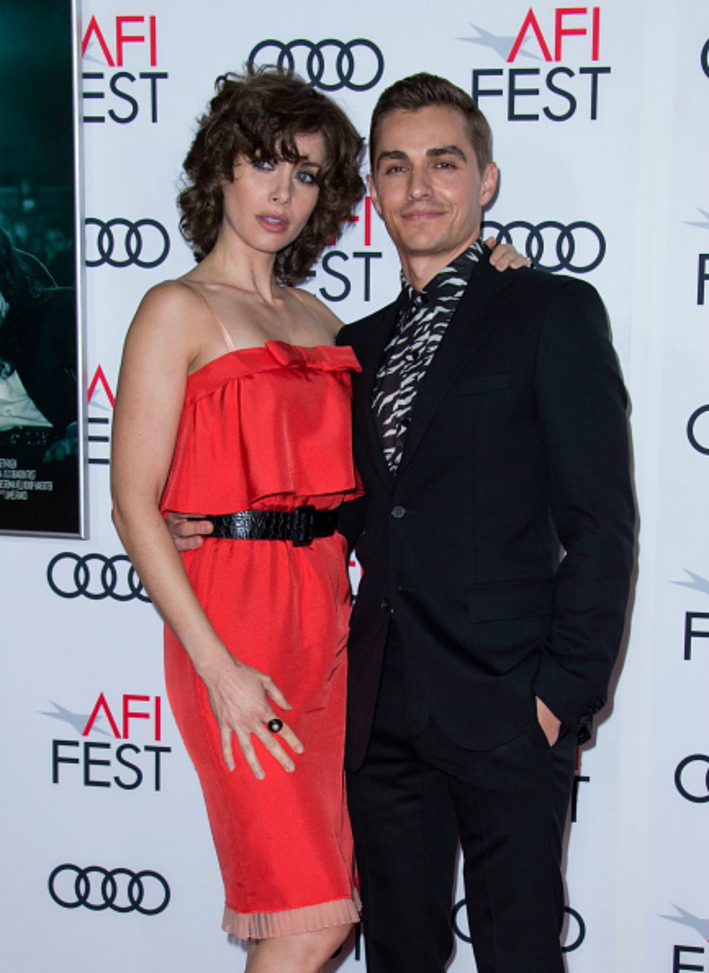 Alison Brie and Dave Franco smile for the camera.