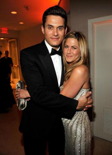 Jennifer Aniston and John Mayer hug.