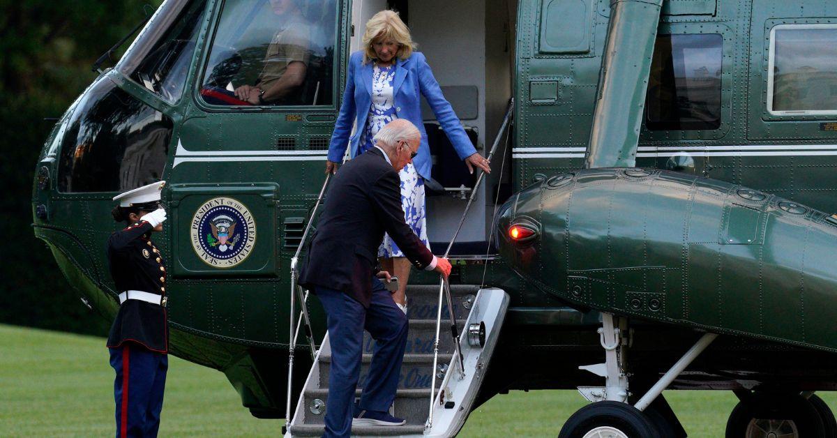 joe biden coughs hand shaking hands back to school students camera jpg