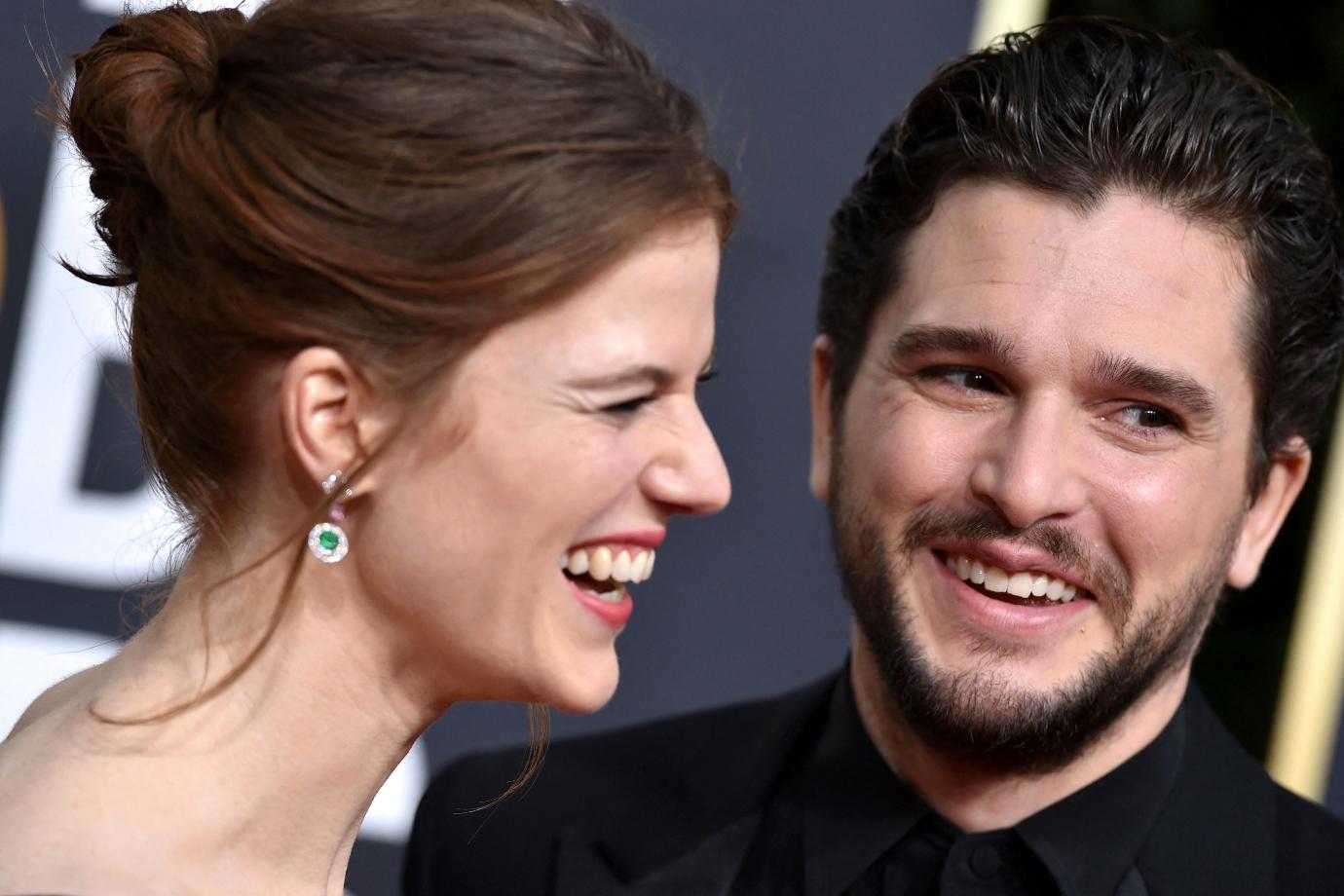 Rose Leslie and Kit Harington smile on the red carpet at the 2020 Golden Globes