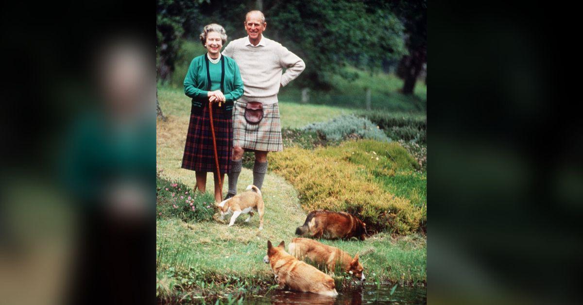 Photo of Prince Philip and Queen Elizabeth with dogs