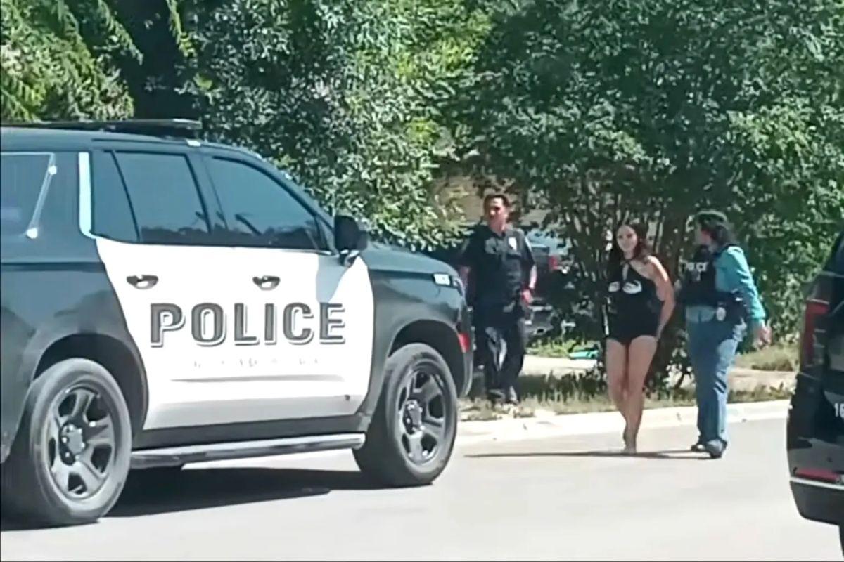 Kitty Mia Diaz, 21, smirked as she was led away in handcuffs.