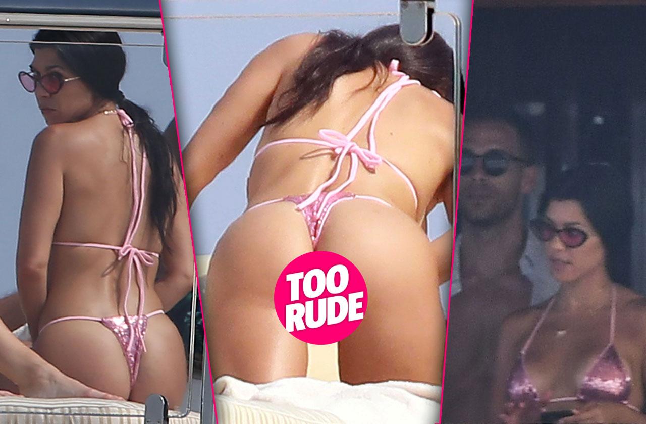 Kourtney Kardashian was caught wearing a thong bikini as she sunbathed with...