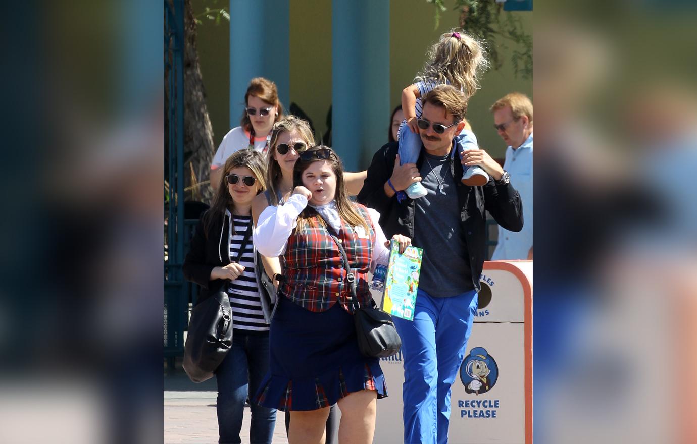 Bradley Cooper enjoys a day at Disneyland with his daughter Lea.