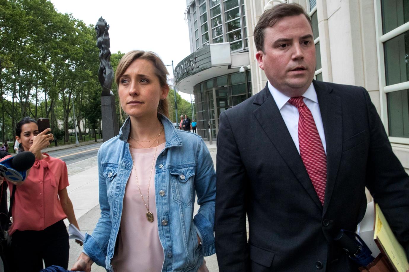 Allison Mack Leaves Court With Lawyer Looking Serious Wearing a Denim Jacket and Pink Top