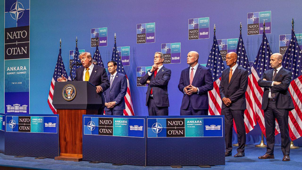 Picture of Trump Administration speaking at a NATO summit.