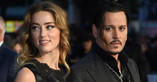 Amber Heard wore a lacy sleeveless gown next to Johnny Depp, who sported a tie-less black suit.