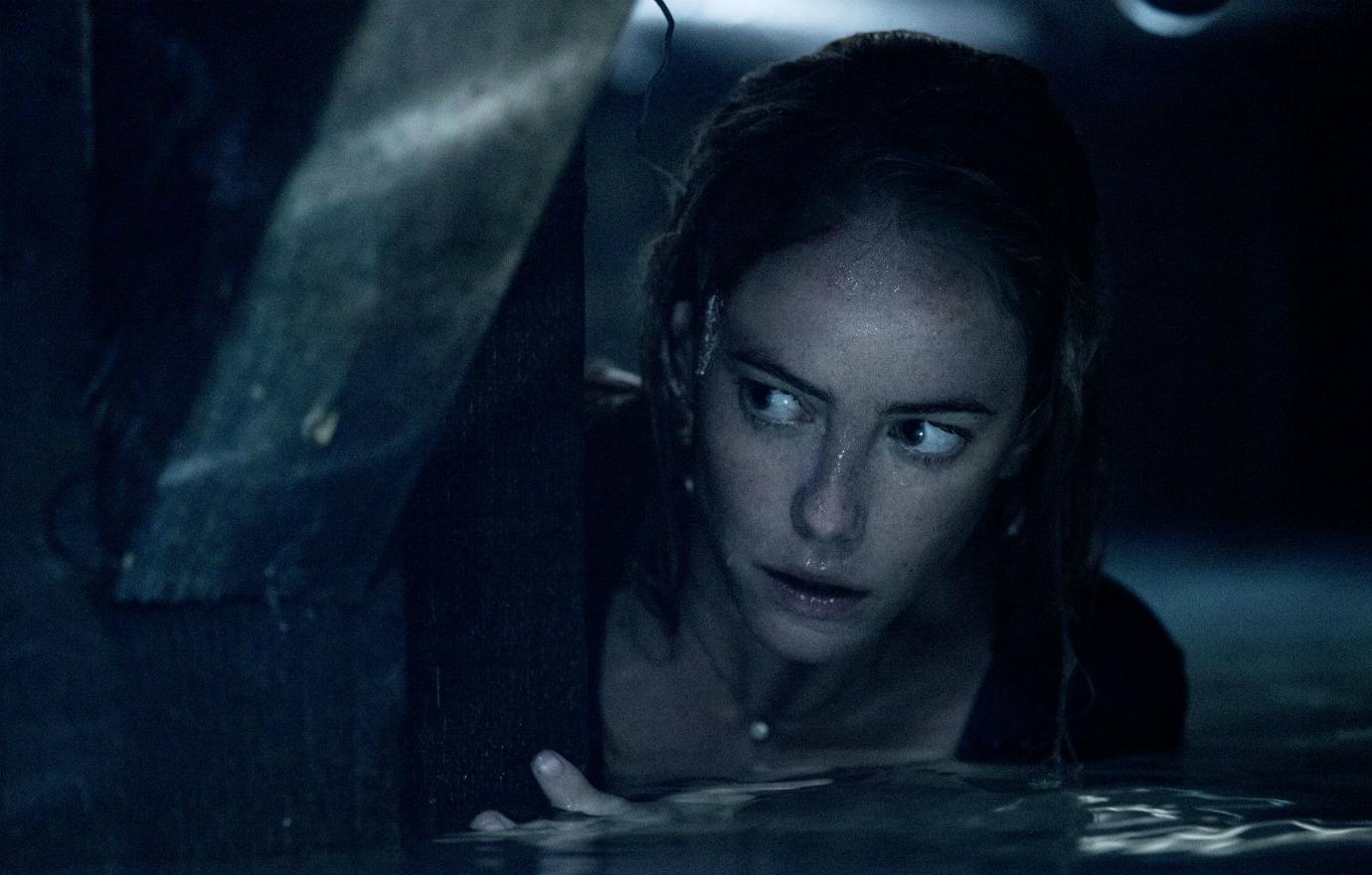 Kaya Scodelario looked warily for an alligator as she tries to survive a Florida hurricane in Crawl.