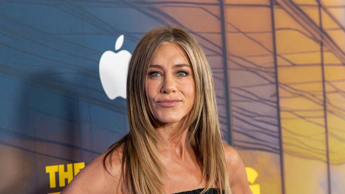 Jennifer Aniston is said to be offering Jim Curtis full support despite friends' concerns over his reported money issues.