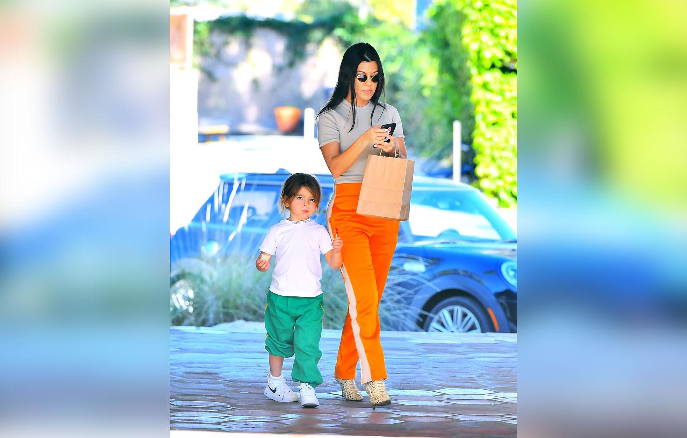 Kourtney Kardashian Hands Son Reign To Scott Disick