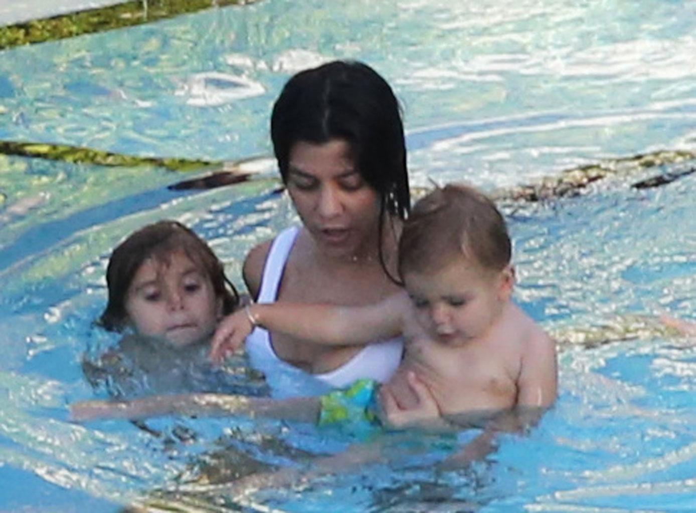 //kourtney kardashian swimsuit pool kids baby reign