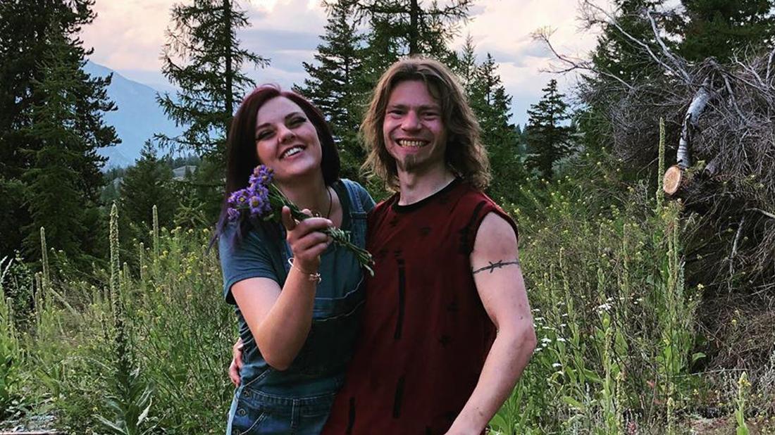 Bear Brown and Raiven Adams Pose Smiling Outside In Nature