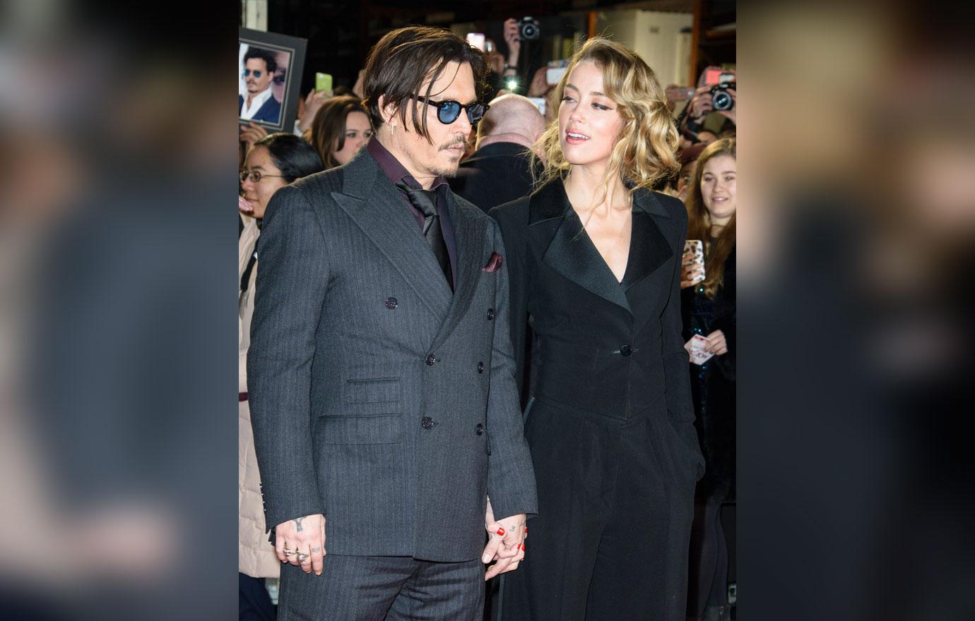 johnny depp sues aclu amber heard  million divorce settlement