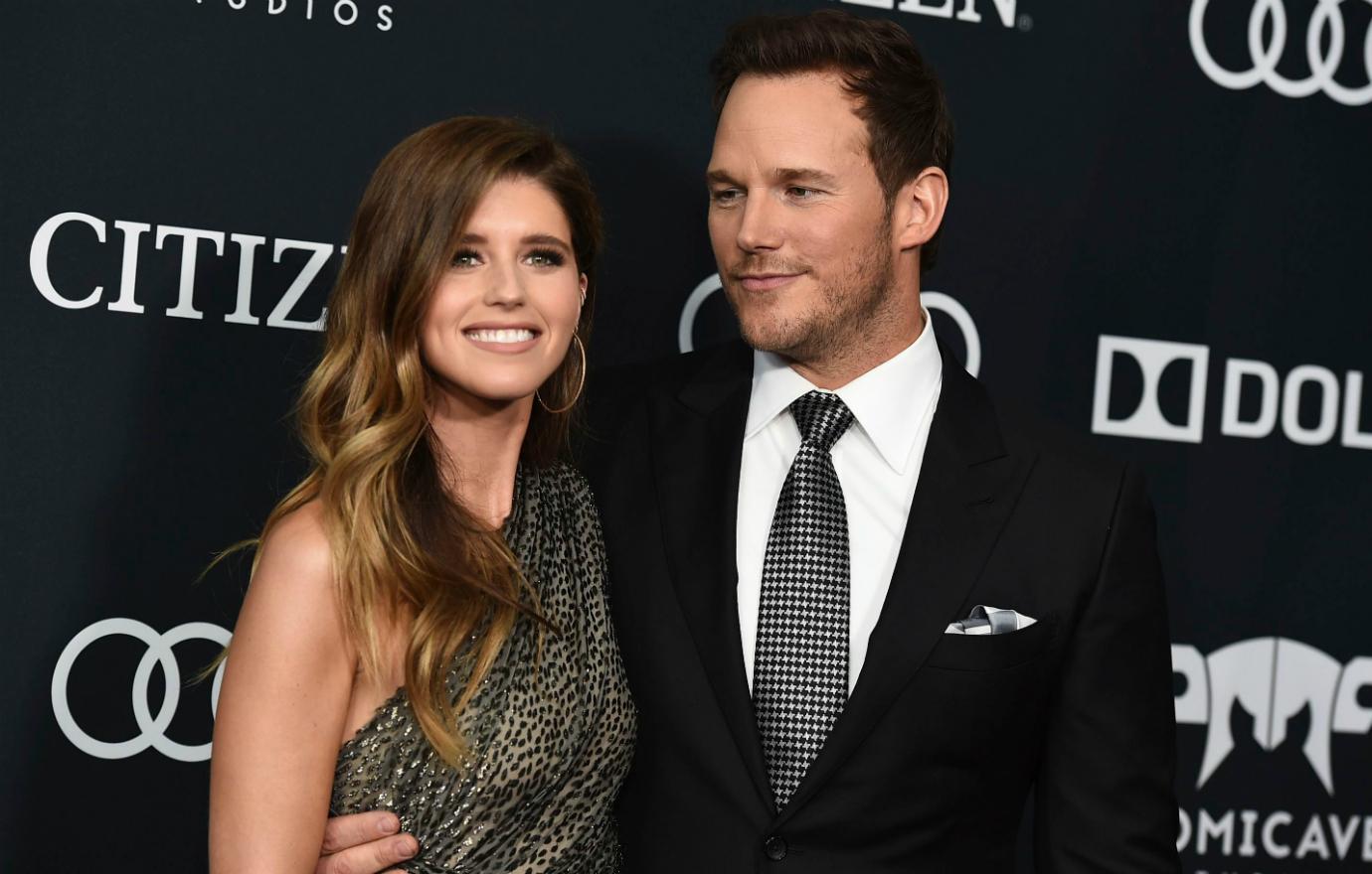 Chris Pratt looked handsome in a black suit as he longingly looked at his date, Katherine Schwartzenegger, who wore a grey off the shoulder dress.