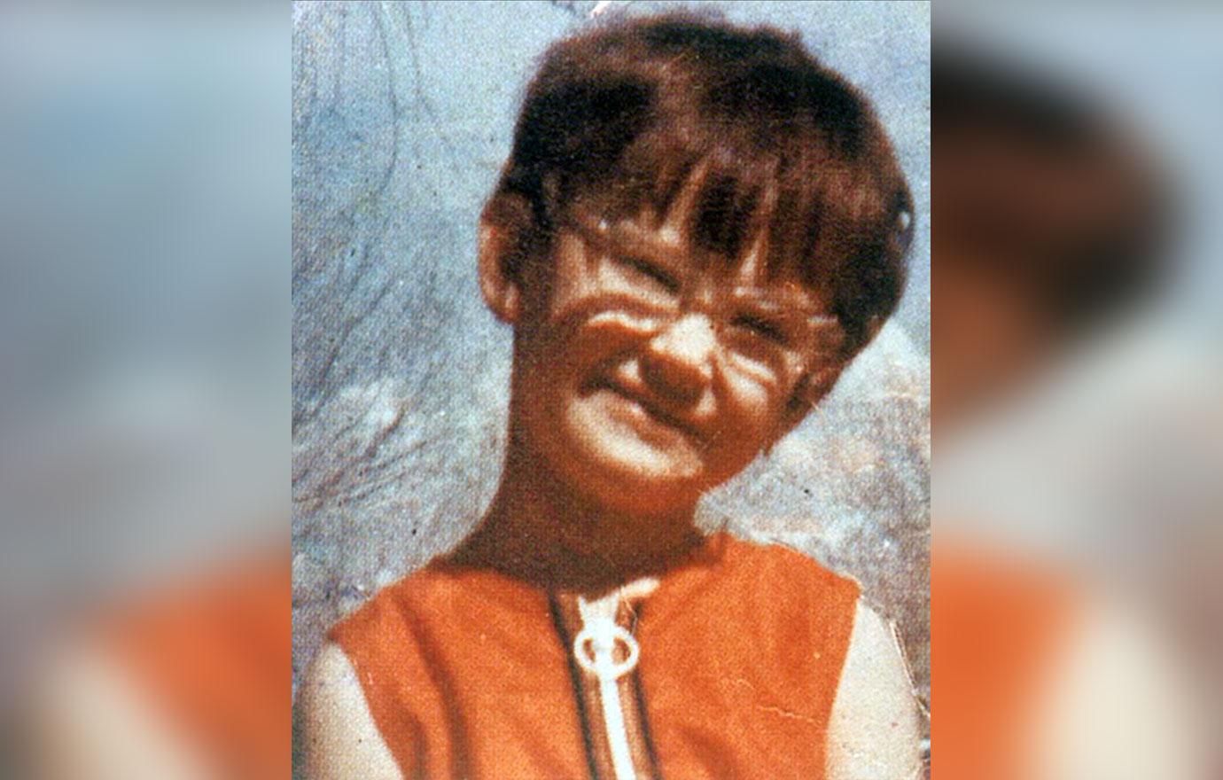 Demi Moore As A Child Wearing Glasses And Orange Zipper Dress