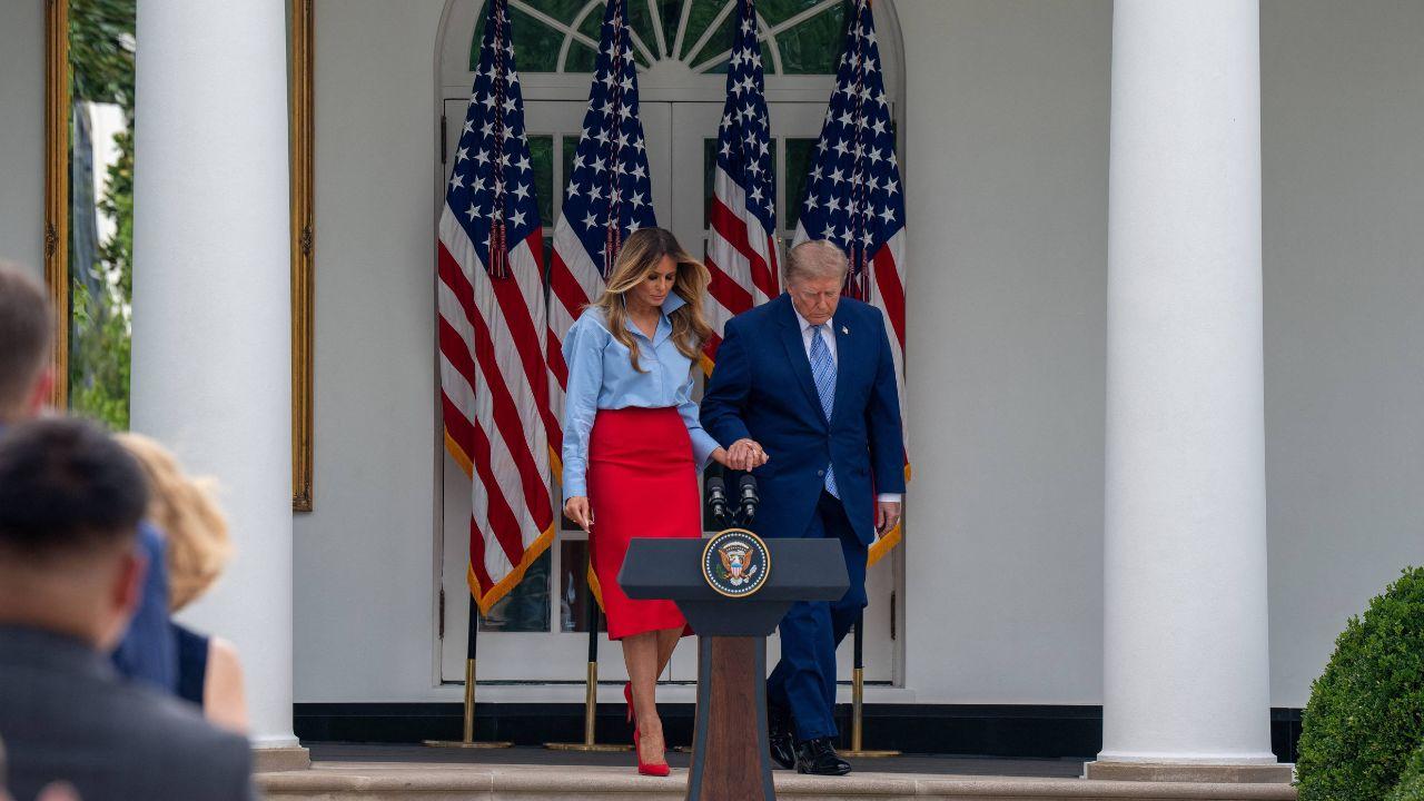She held her husband Donald's hand tightly in a show of solidarity.