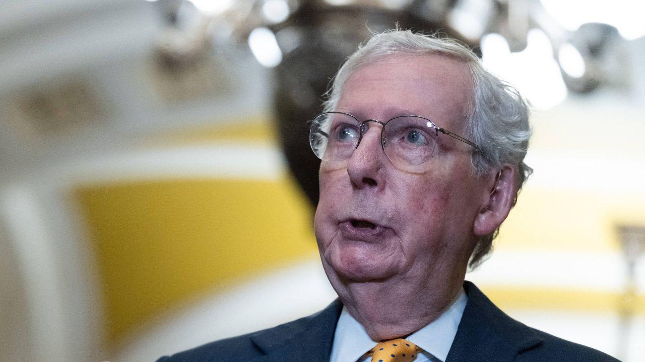 image of Mitch McConnell was seen acknowledging reporters with a thumbs-up and peace sign while declining to answer questions.