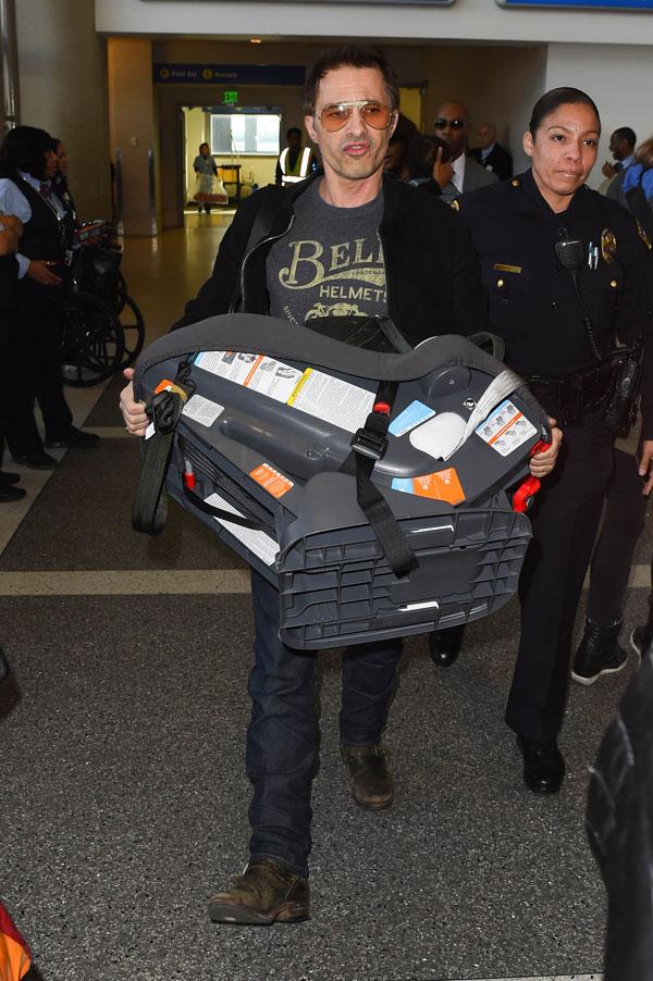 //olivier martinez pushes airport worker