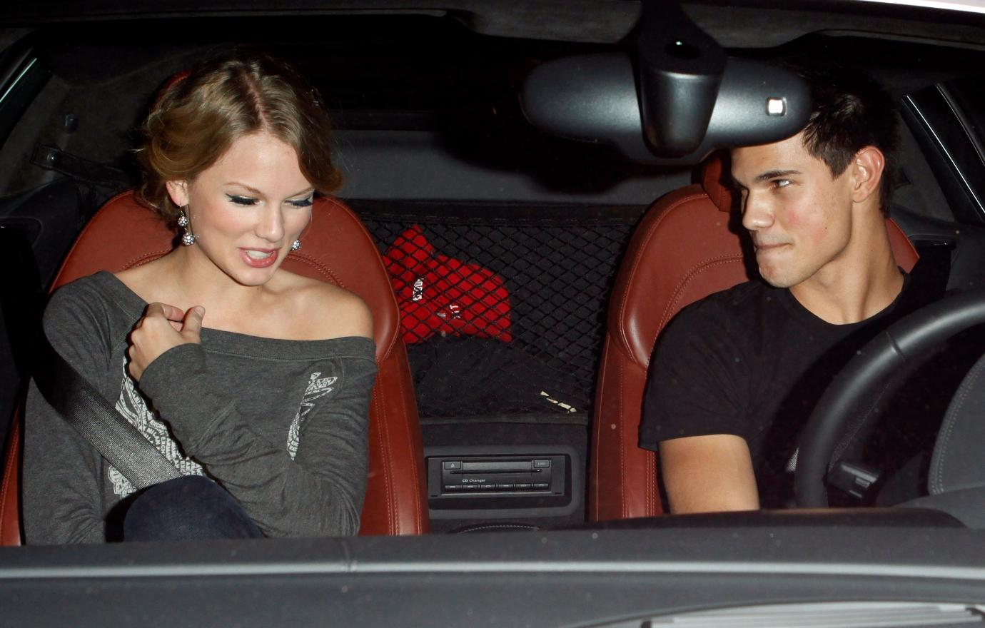 Taylor Swift and Taylor Lautner sit in a car