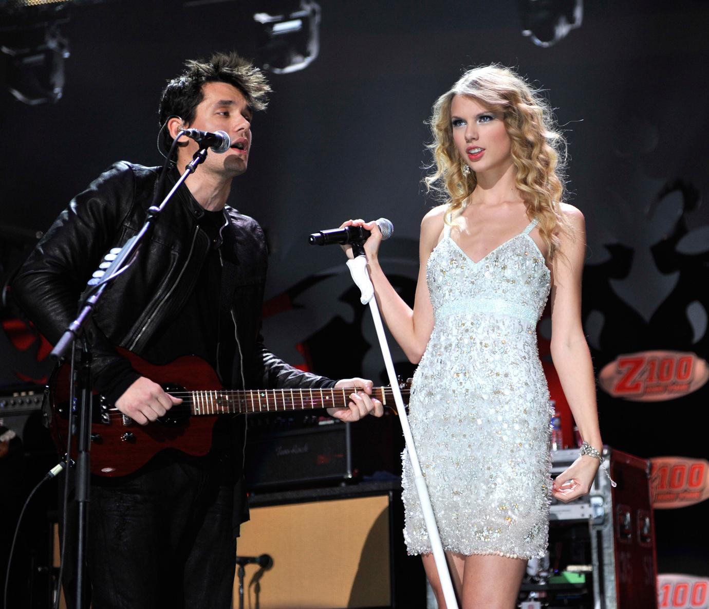 Taylor Swift Performs in White Dress On Stage Alongside John Mayer