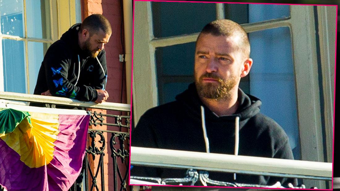 Justin Timberlake flashes a smile as he enjoys views of New Orleans from a  balcony