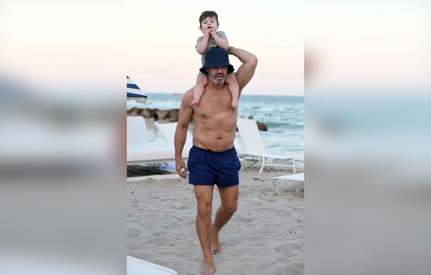 Andy Cohen Looks Buff On Beach With Baby Son