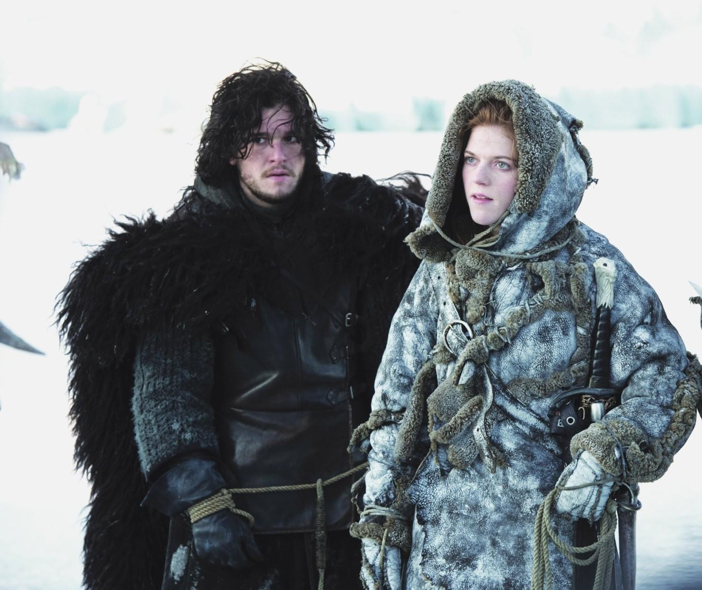 Jon Snow and Ygritte played by Kit Harington and Rose Leslie stand in the snow on Game of Thrones in 2011