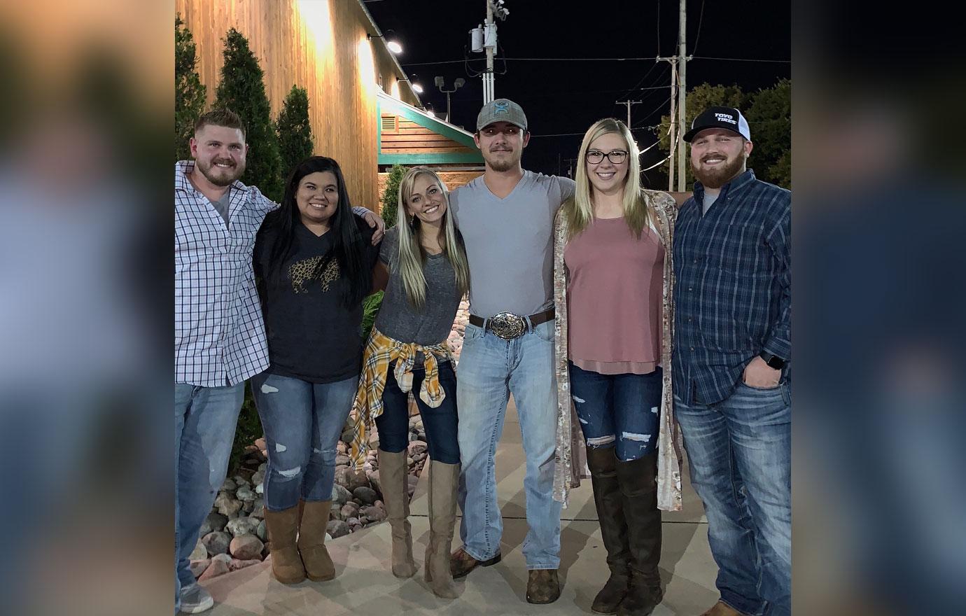 Mackenzie and Josh McKee take a group photo.