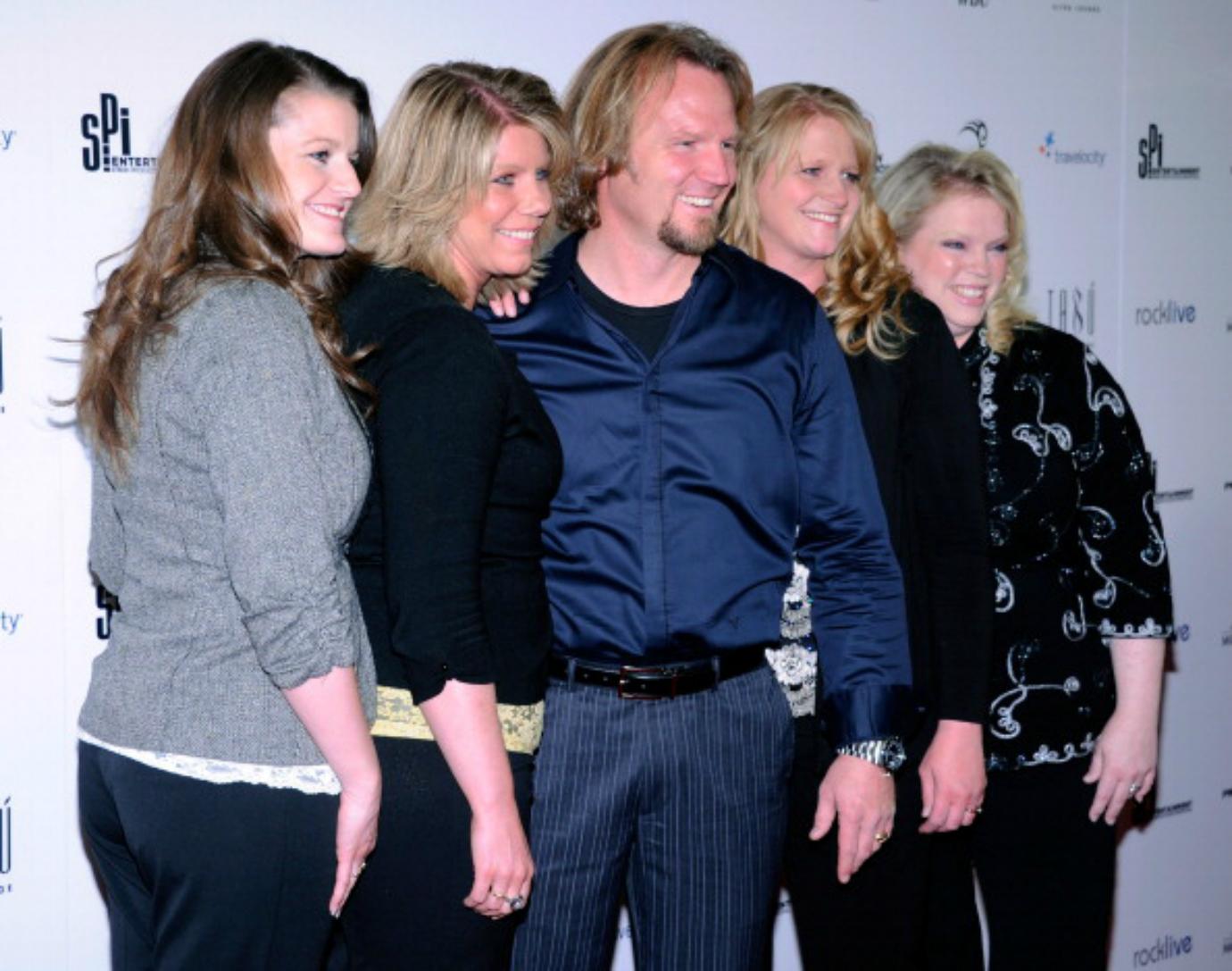 The cast of 'Sister Wives' looks toward photographers