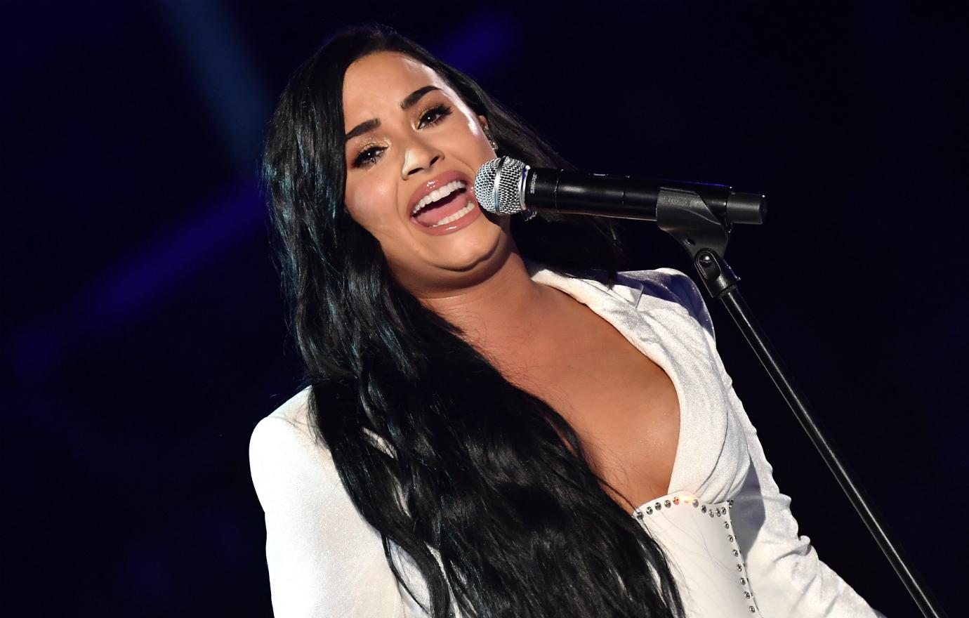 Demi Lovato stunned in a white dress as she sang the national anthem at the Super Bowl.