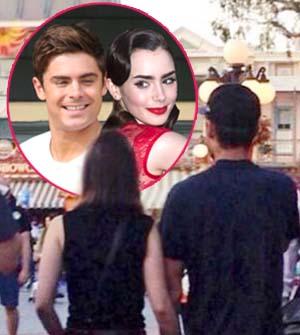 zac-efron-lily-collins-disneyland-california-holding-hands