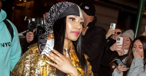 nicki minajs england concert postponed detained amsterdam airport