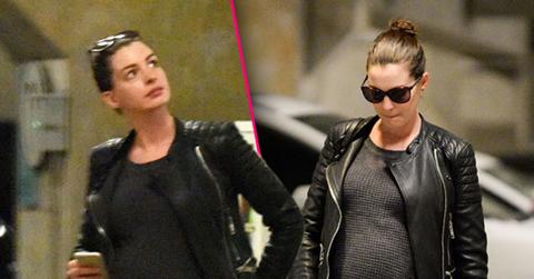 //anne hathaway pregnant baby bump leather jacket pp