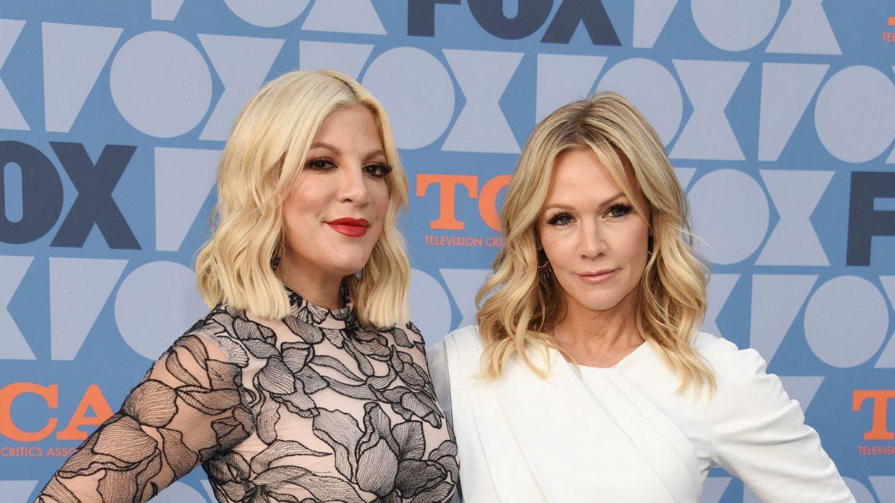 Tori Spelling and Jennie Garth are reportedly at odds following Spelling's exit from the '9021OMG' podcast.