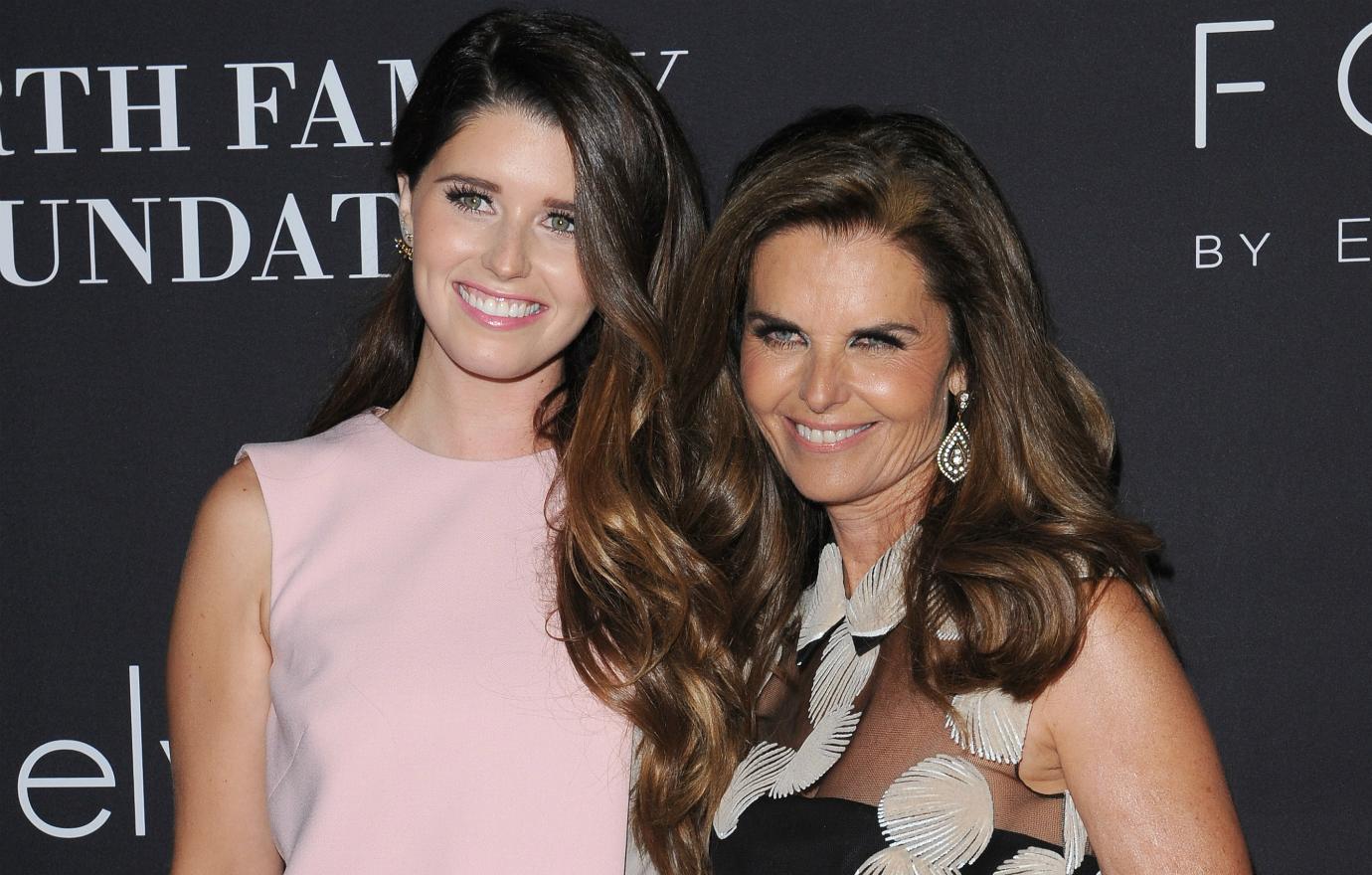 Katherine Schwarzenegger looked pretty in pink while Maria Shriver dazzled in a black, lacy flower dress.