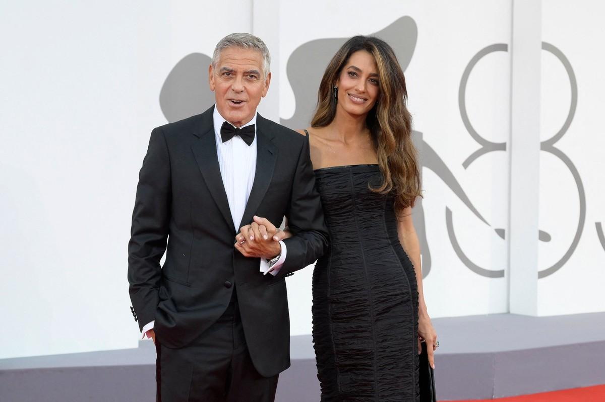 Amal and George Clooney choose work projects to prioritize their twins, he said.