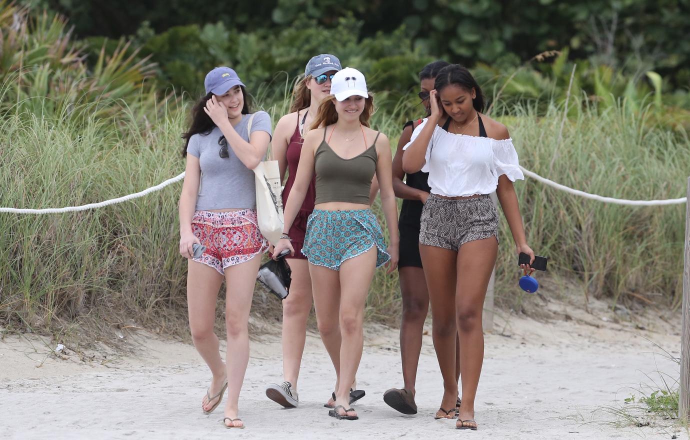 Sasha walks with some friends in Miami