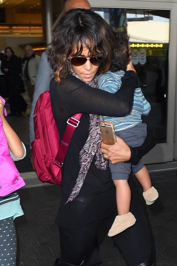 //olivier martinez pushes airport worker