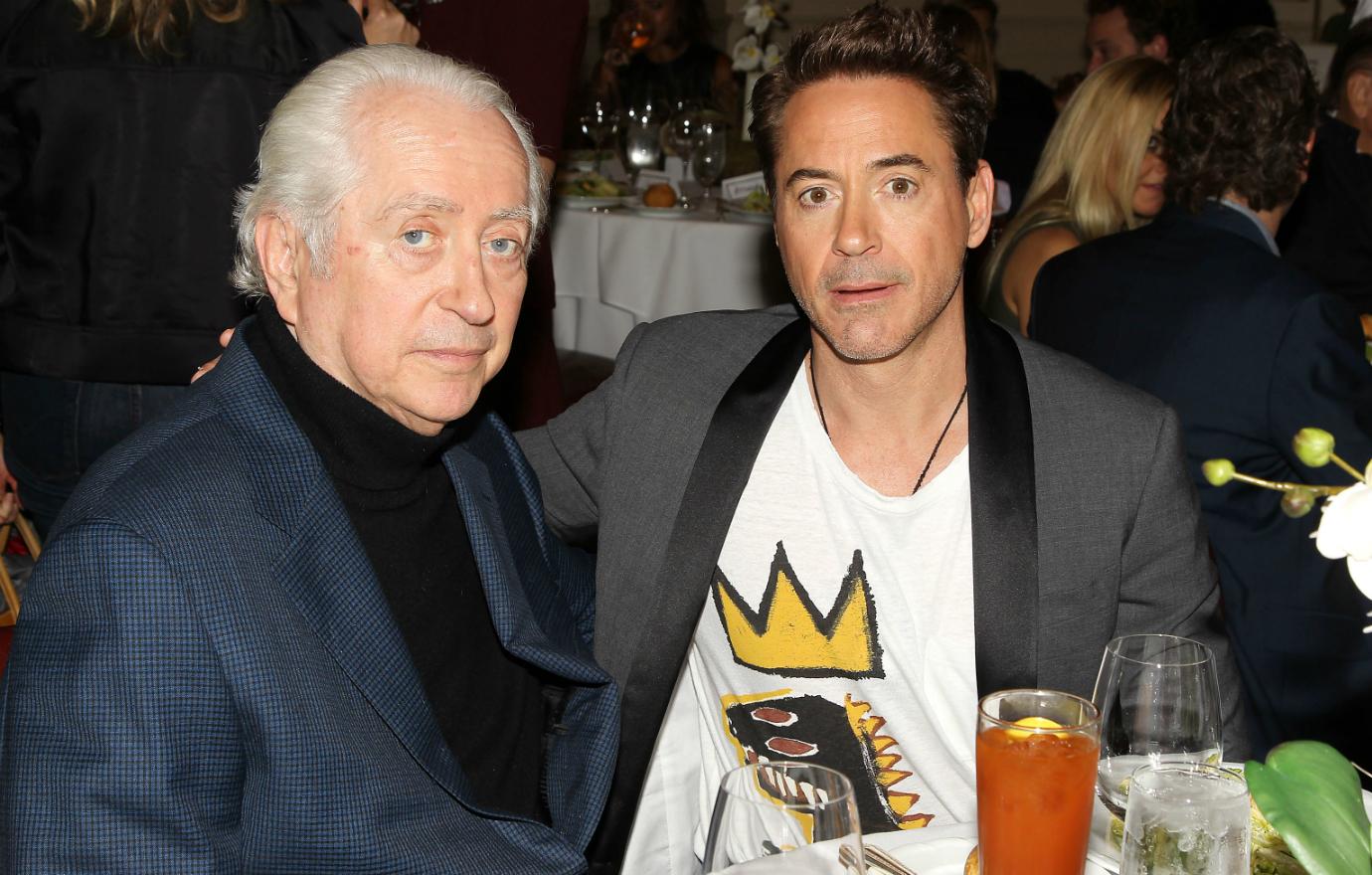 Robert Downey Jr. and Robert Downey Sr., at an event that saw Senior wore a blue blazer with a black turtleneck and Junior sported a grey blazer with a decorative T-shirt.