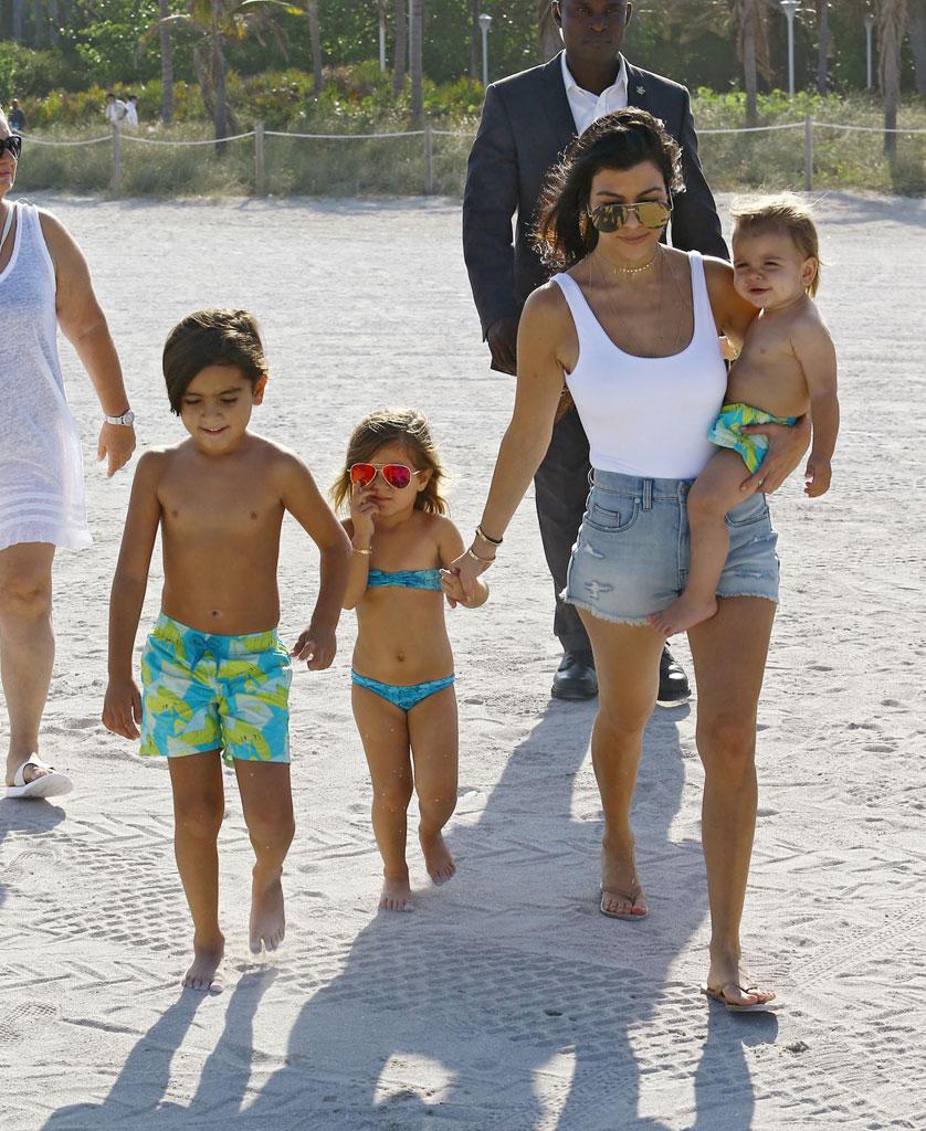 //kourtney kardashian swimsuit pool kids baby reign