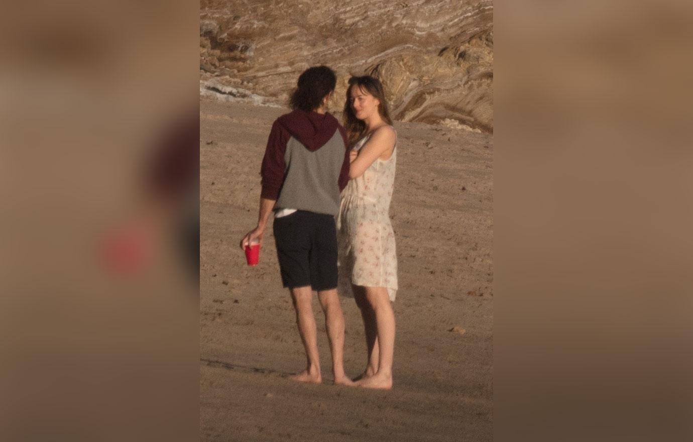 Chris Martin Dakota Johnson Beach PDA