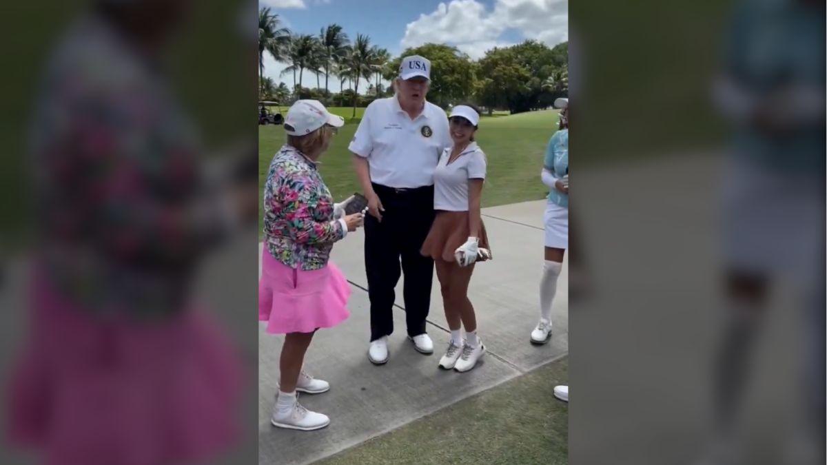 Trump's interaction with the woman included a hug as bystanders looked on.