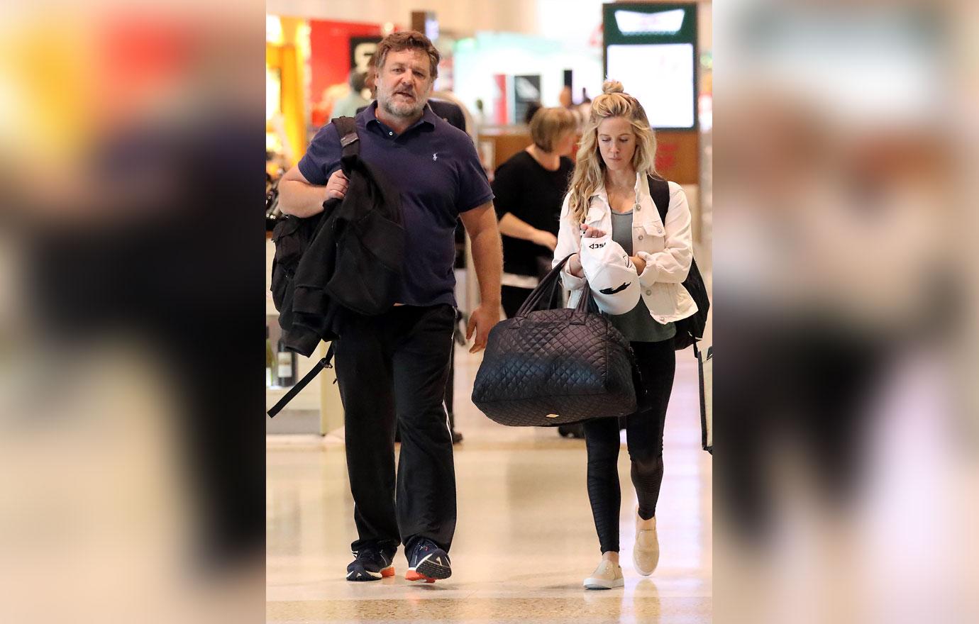 Russell Crowe Shows Off Weight Gain While With New Assistant