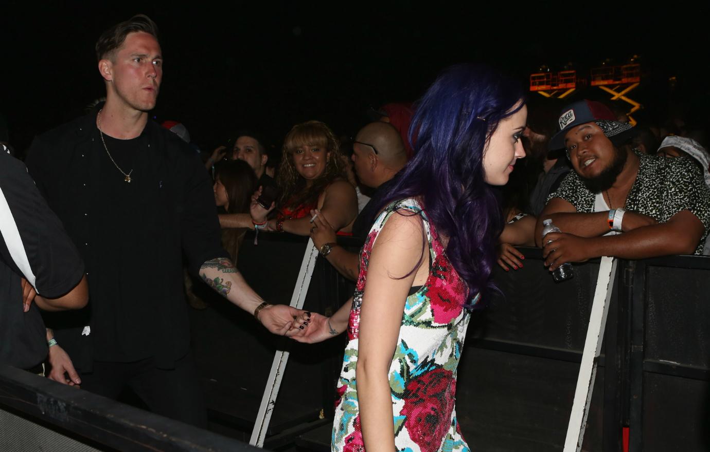 Robert Ackroyd and singer Katy Perry in the audience during day 3 of the 2012 Coachella Valley Music & Arts Festival at the Empire Polo Field on April 15, 2012 in Indio, California.