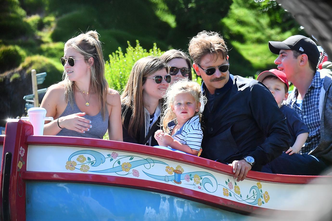 Bradley Cooper enjoys a day at Disneyland with his daughter Lea.